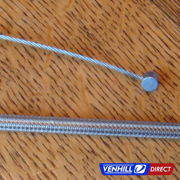 Closeup of Venhill braided stainless throttle cable kit outer conduit and wire