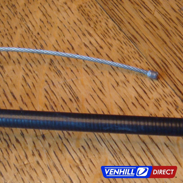 Closeup of Venhill throttle cable kit outer conduit and wire
